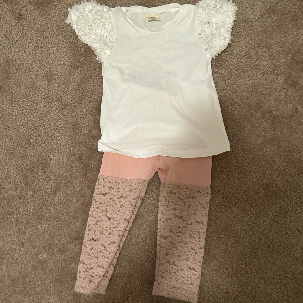 White top with lace leggings.